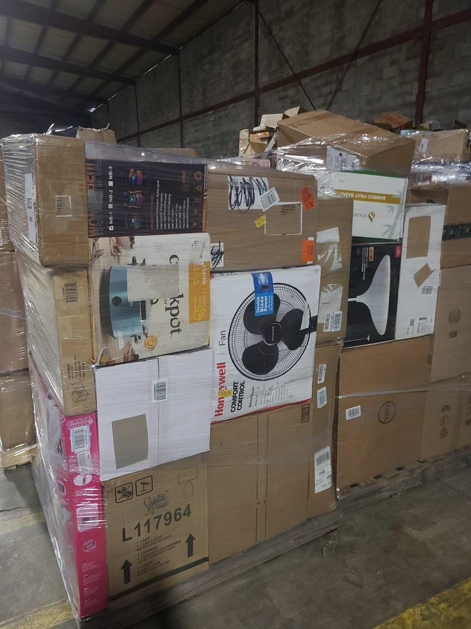 TRGT Bulk Overstock Pallets A variety of TRGT overstock items including furniture, electronics, toys, and home goods packed into pallets for resale.